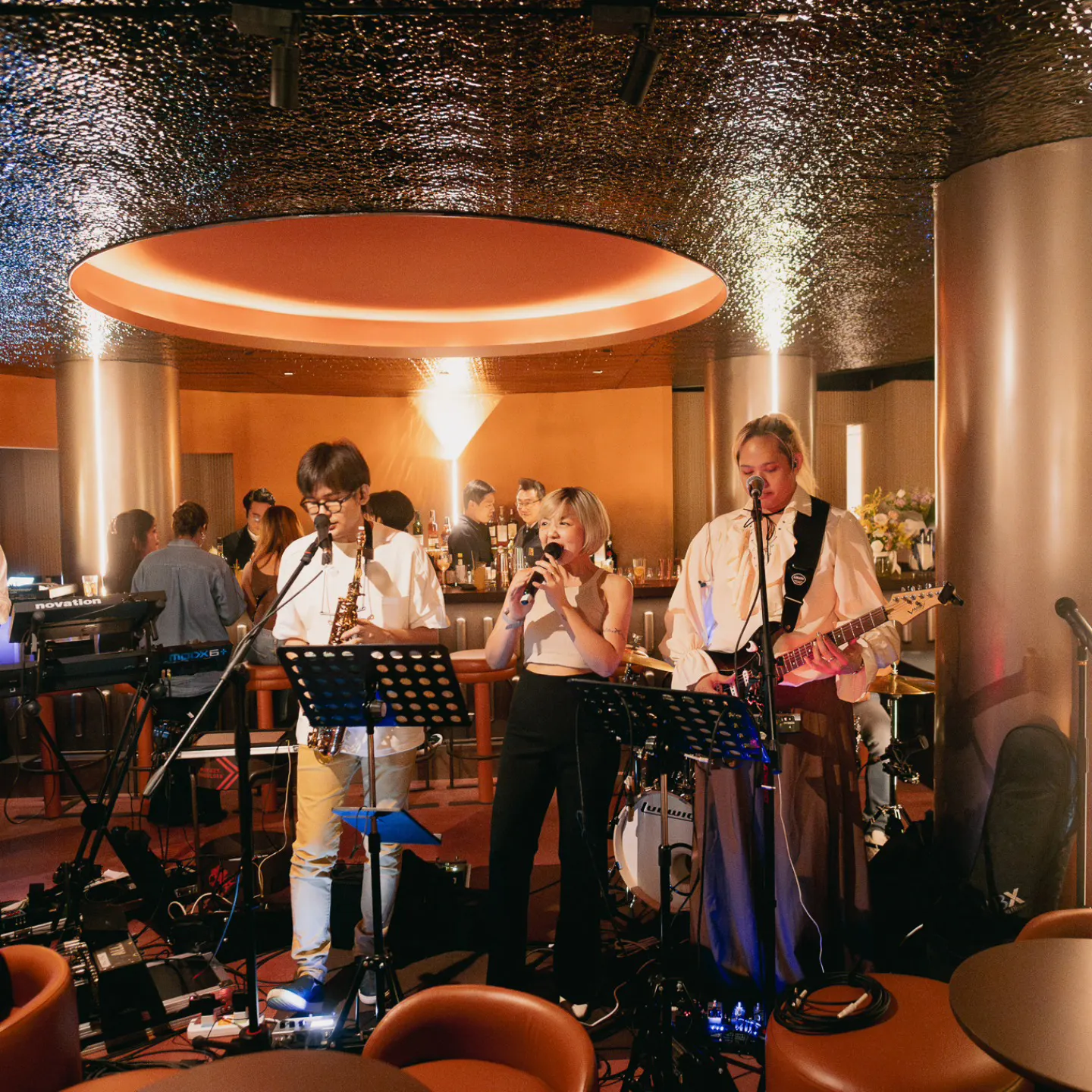 Find the Photo Booth-7-band-performing-in-bar-area